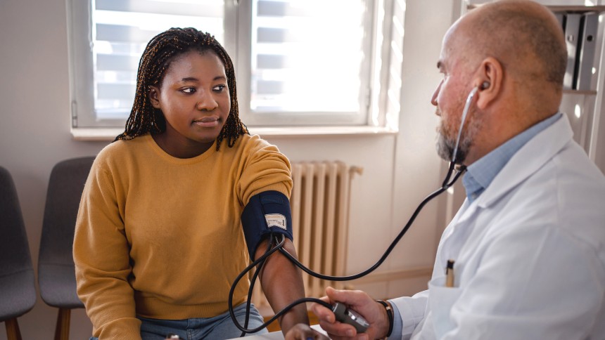 African American woman getting blood pressure taken