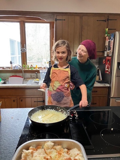 Barbara Grathwohl teaching youngest grandchild family recipe for Thanksgiving stuffing, Thanksgiving 2023