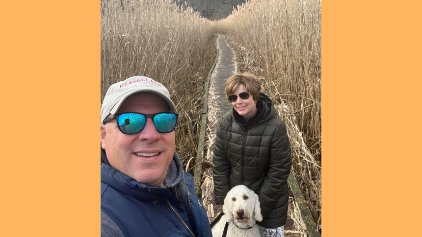  Nuvance Health employee Eileen Miller on a hike with her husband Rob Sweet and Goldendoodle George. Eileen had a carotid dissection that could have caused a stroke without emergency care. 