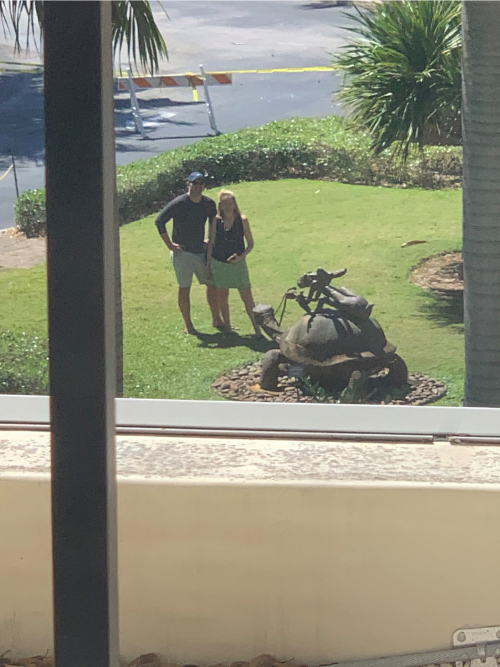 Lisa Foster and Jack Foster outside Mike Foster’s hospital room window where he recovered from a stroke. They could not visit because of COVID-19. They are in Florida.