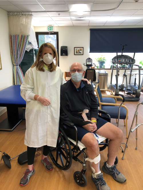 Married couple Lisa and Mike Foster are in a hospital room wearing masks after Mike had a stroke.