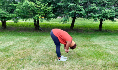 Woman doing a hamstring stretch.