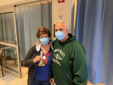 Vassar Brothers Medical Center breast cancer patient Linda Deserto with her husband. Linda is ringing a bell after completing treatments.