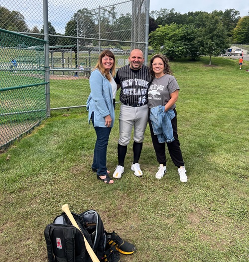 VBMC colon cancer patient John Manganiello with his aunt and wife on the baseball field.