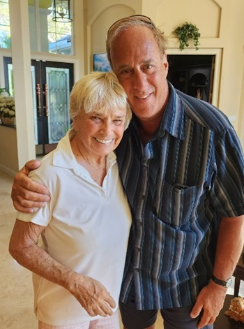 Gayle Bontecou and Dr. John Sabia. She is wearing a white shirt and he is wearing a striped blue collared shirt.