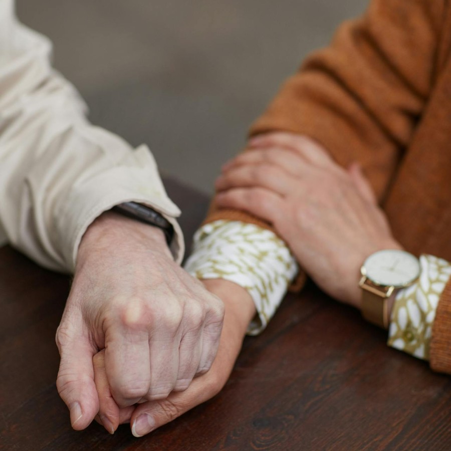 Couple holding hands