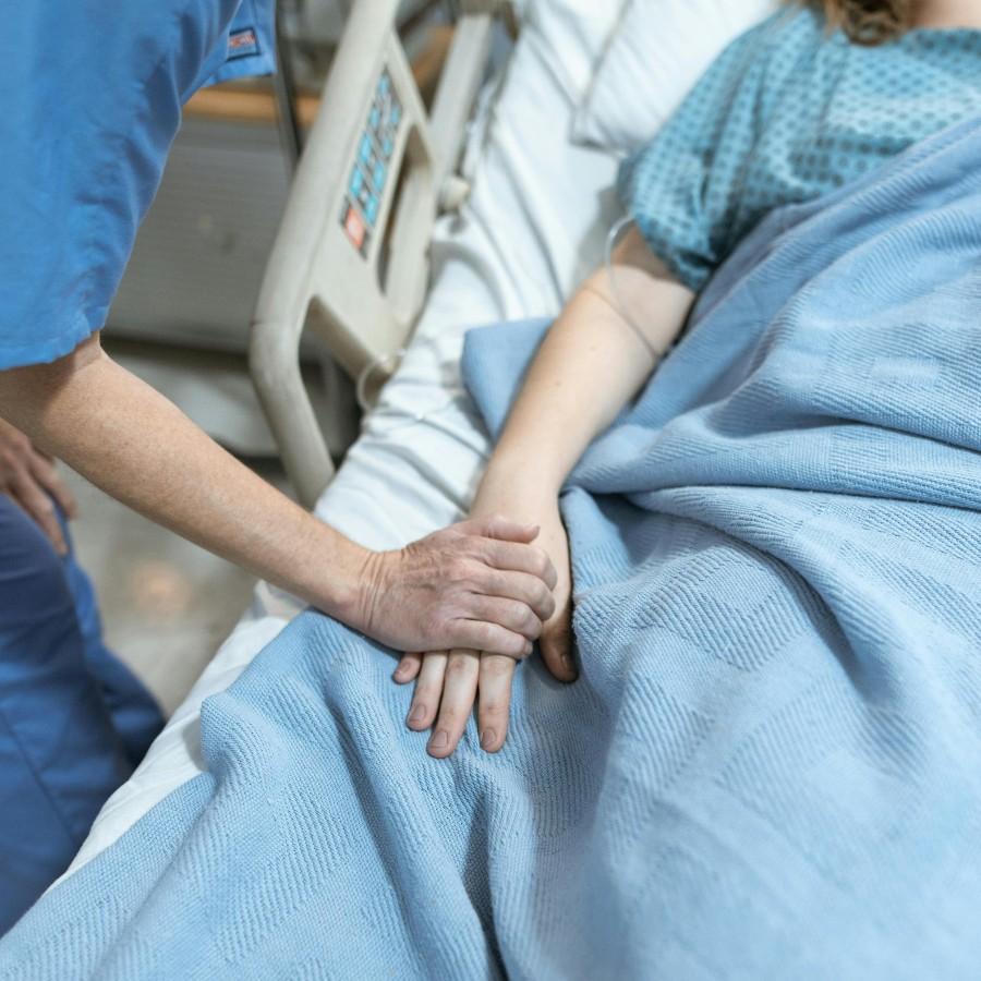 Inpatient care - doctor holding patients arm