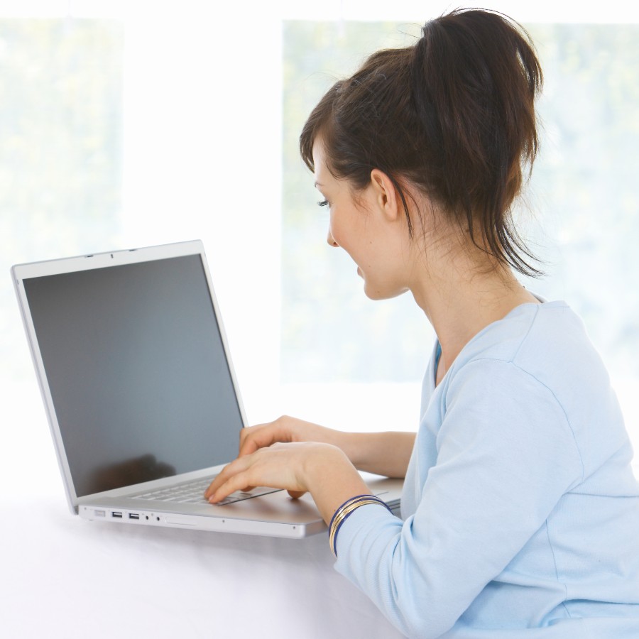 Health Information Exchange - Woman on laptop