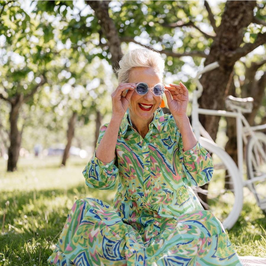 Elderly woman with designer dress and sunglasses