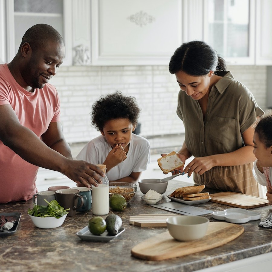 Family making healthy meal in kitchen