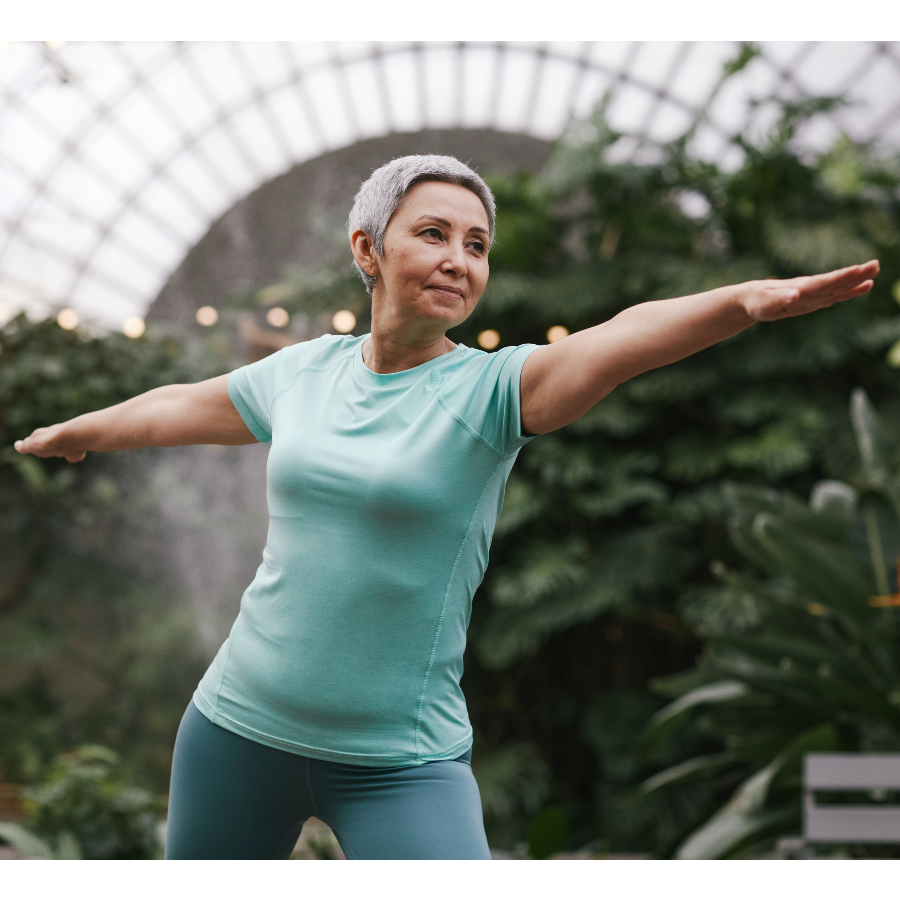 Women stretching in teal shirt