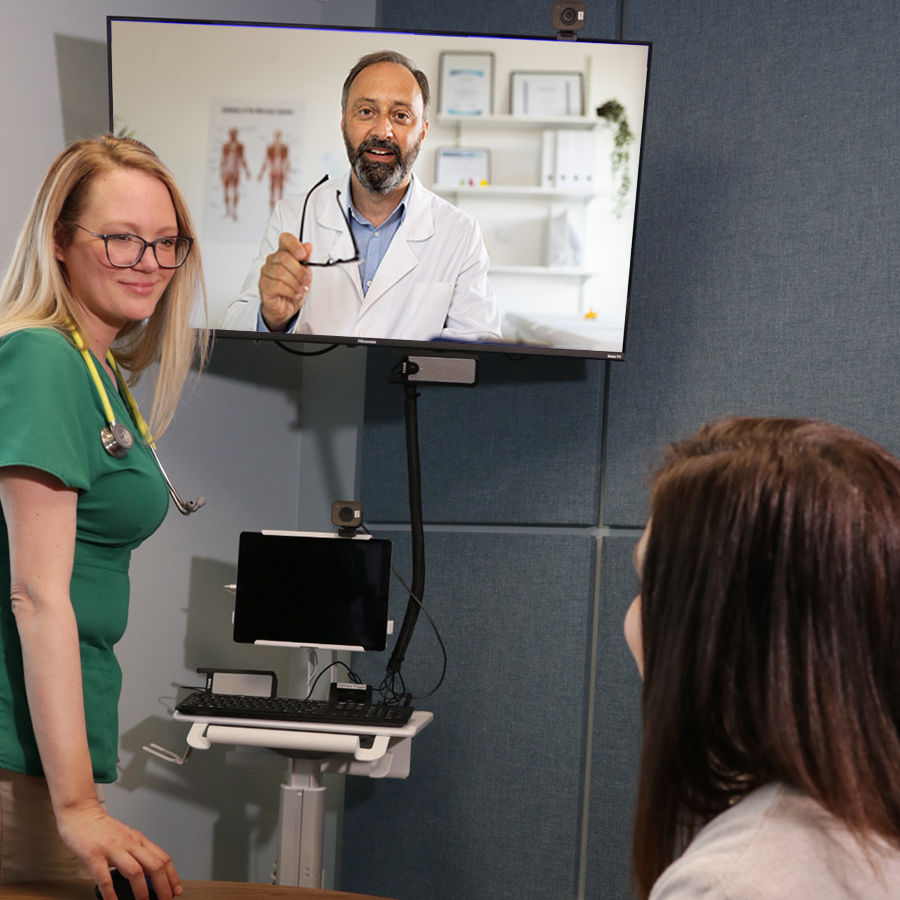 Woman on telehealth visit with a Nuvance Health specialist and nurse
