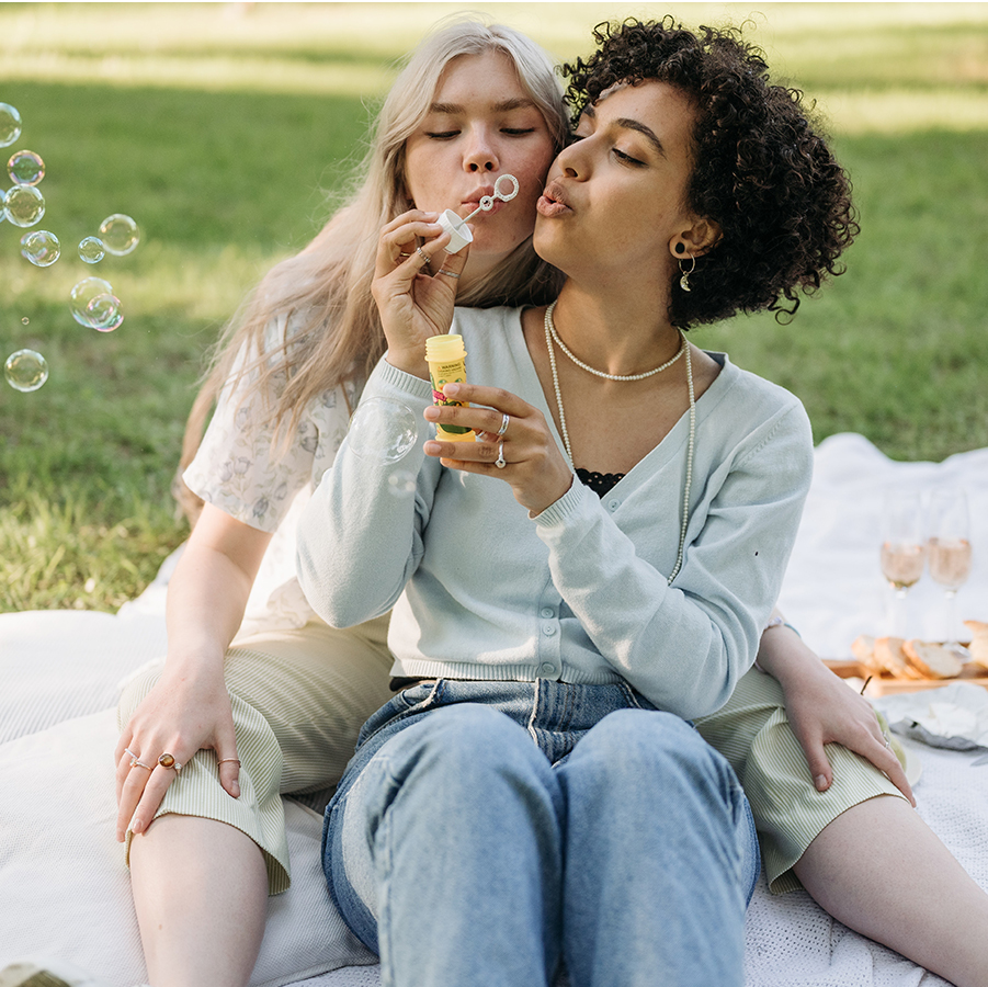 Couple blowing bubbles