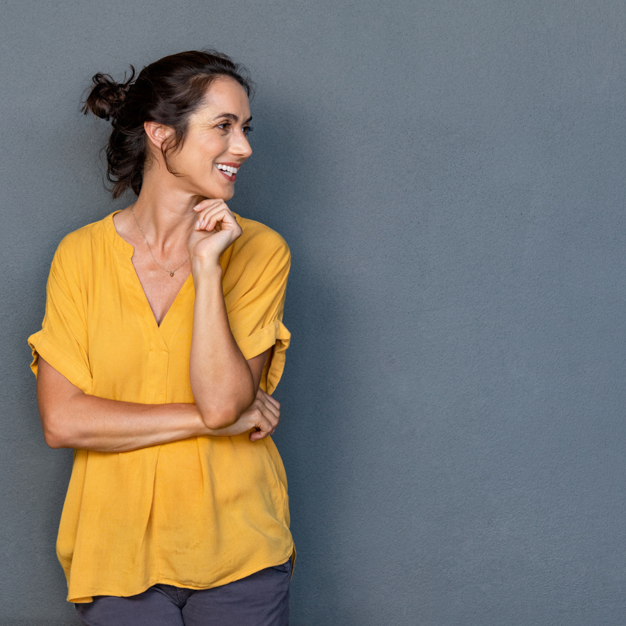 Happy mature woman looking away