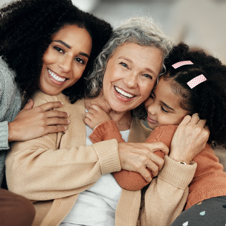 Happy, hug and portrait of family on mothers day, visit and affection while bonding. Smile, love and mother, child and grandmother hugging, being affectionate and cheerful for quality time together