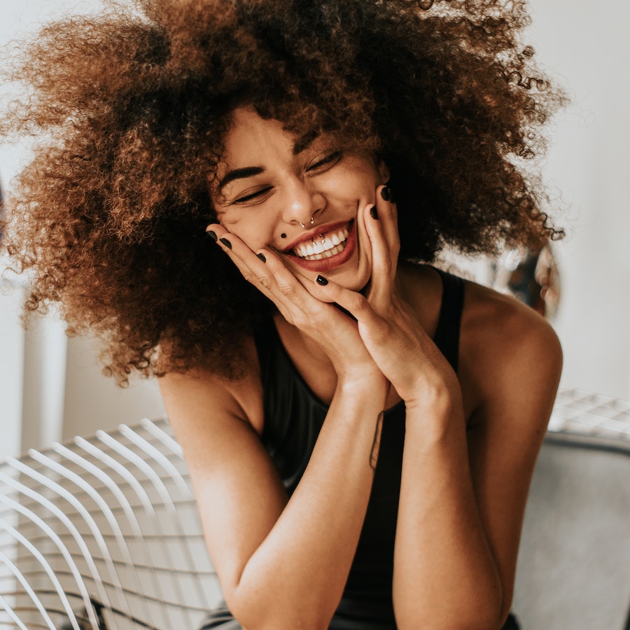 Woman sitting and smiling