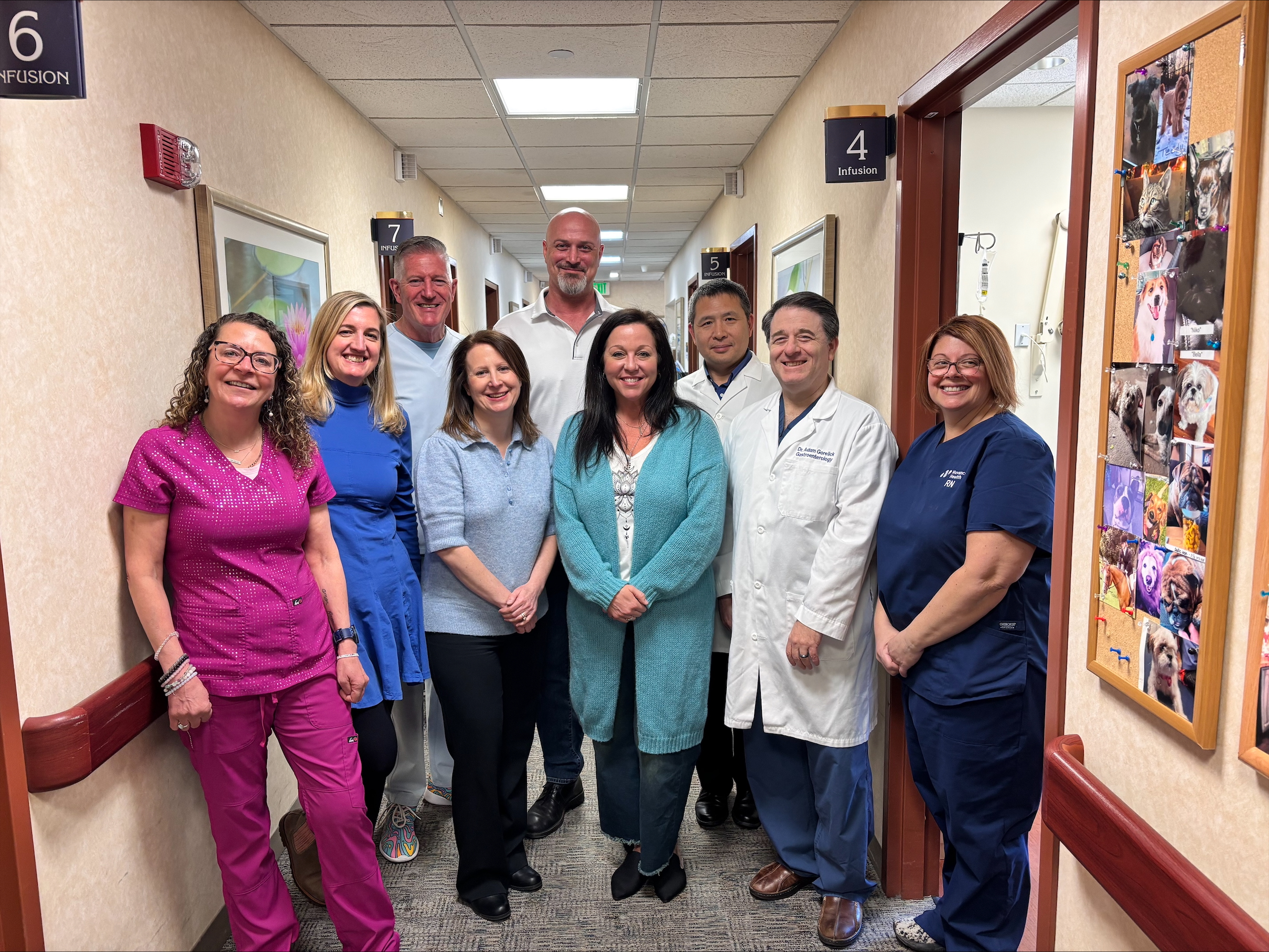 Chris Gergovich, a Danbury Hospital colorectal cancer patient, with his care team at the Praxair Cancer Center.