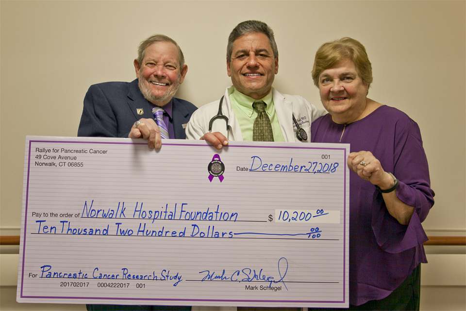 Mark Schlegel (left). Dr. Richard Frank (middle) and Pauline Schlegel (right). Schlegel’s raised funds for pancreatic cancer research at the Norwalk Hospital Whittingham Cancer Center.