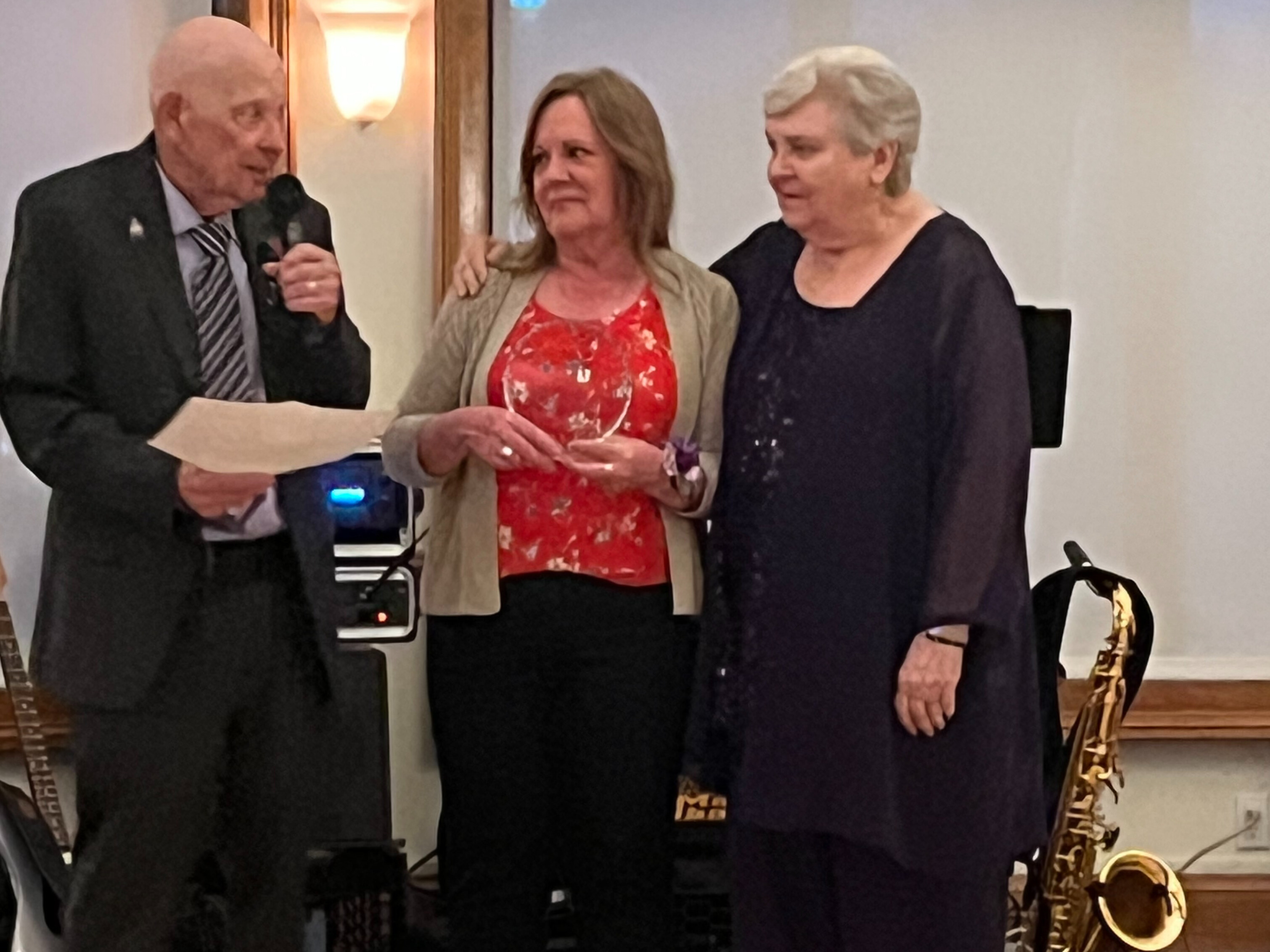 Pauline and Mark Schlegel recognized Valarie Solis, Norwalk Hospital Whittingham Cancer Center medical oncology nurse supervisor, at the event to celebrate 10 years of Mark surviving pancreatic cancer.