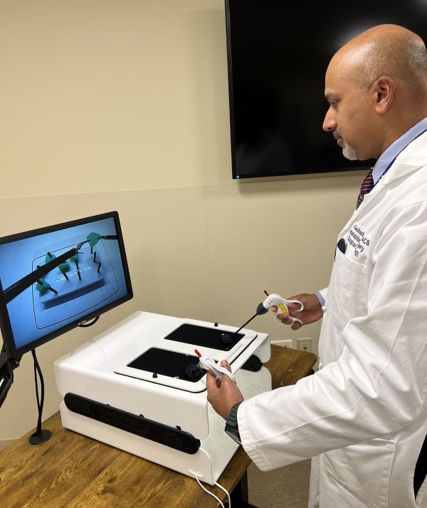 Dr. Ramanathan Seshadri demonstrates a surgical simulation model.
