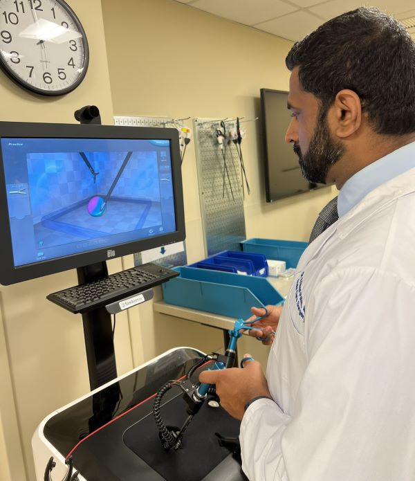 Dr. Ramanathan Seshadri demonstrates a surgical simulation model.