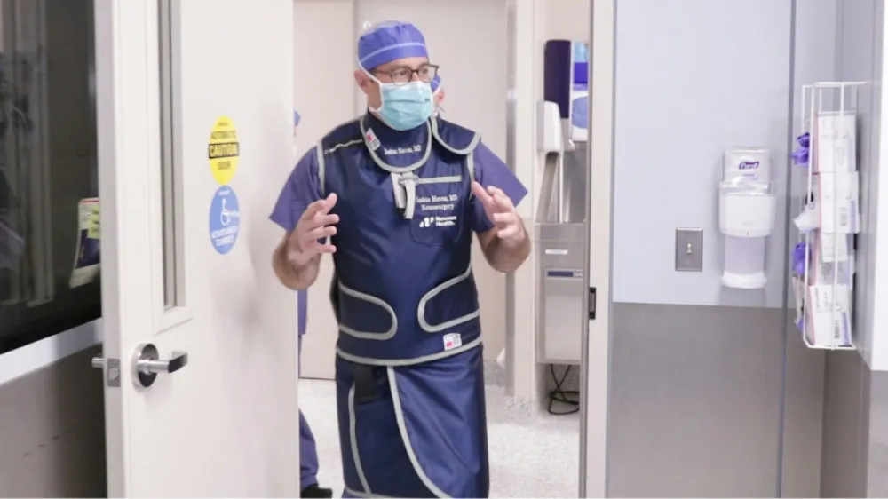 Joshua Marcus, MD, Neurosurgeon, walking into the operating room at Danbury Hospital.