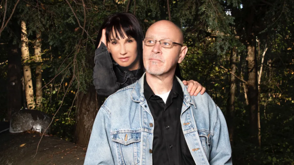Michael and his wife Gloria posing for a photo.