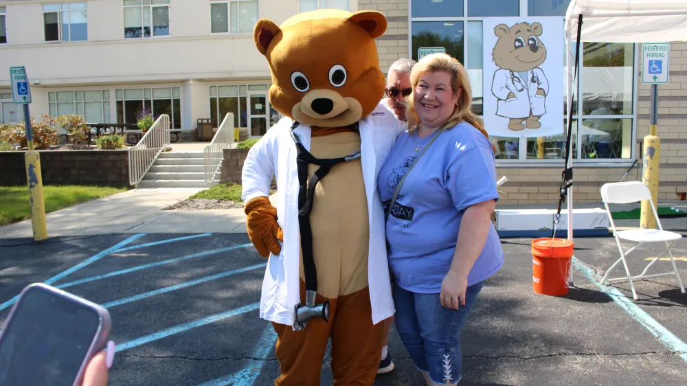 Dr. Bear joins in on the fun at Kids' Day 