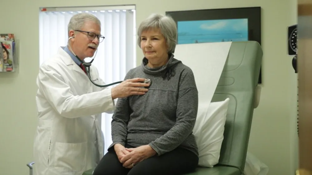 Harvey Kramer MD with patient 860x484
