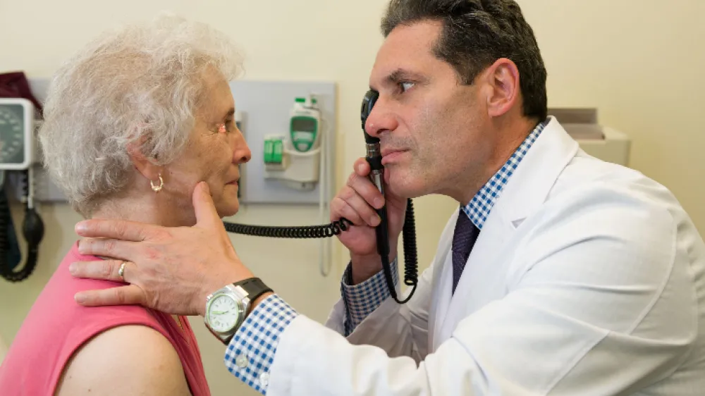 Hero Dr Paul Wright with Patient