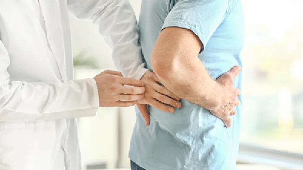 nephrology-clinician-hands-back-patient